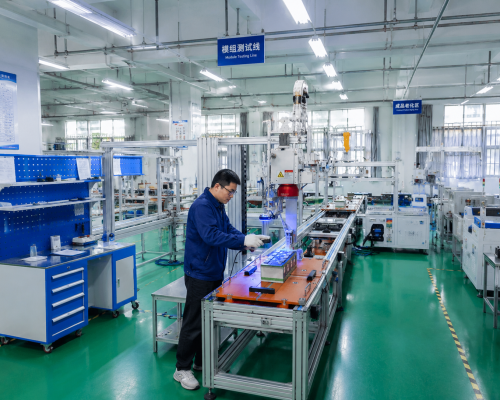 Engineer performing quality testing on GWM Energy lithium battery systems in an advanced automated manufacturing facility. Engineer performing quality testing on GWM Energy lithium battery systems in an advanced automated manufacturing facility.